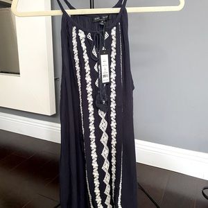 Romeo & Juliet Couture navy and cream crochet appliqué. Size medium, never worn